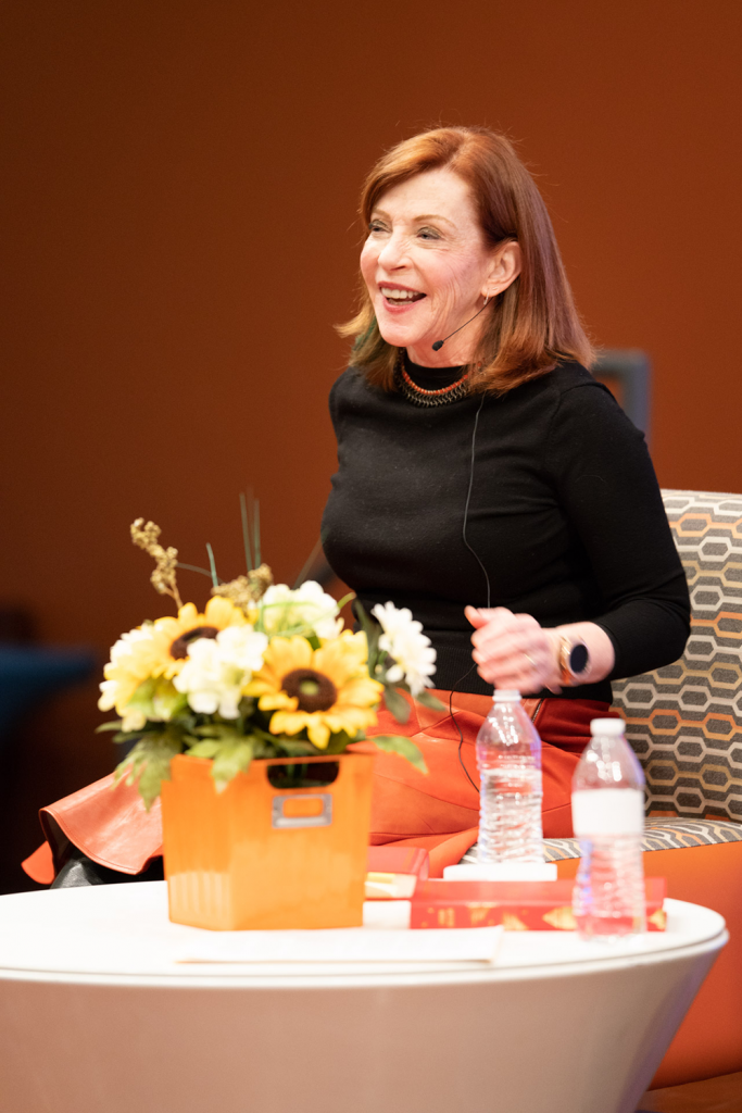 Susan Orlean on stage with flowers