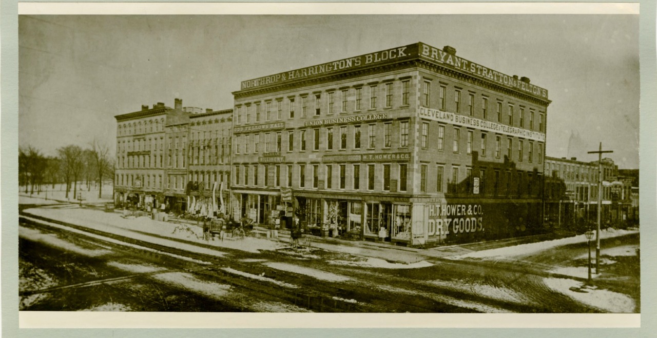Yellowed black and white photo of 1st Main Library - Northrup and Harrington Block, West 3rd street and Superior Avenue in 1869